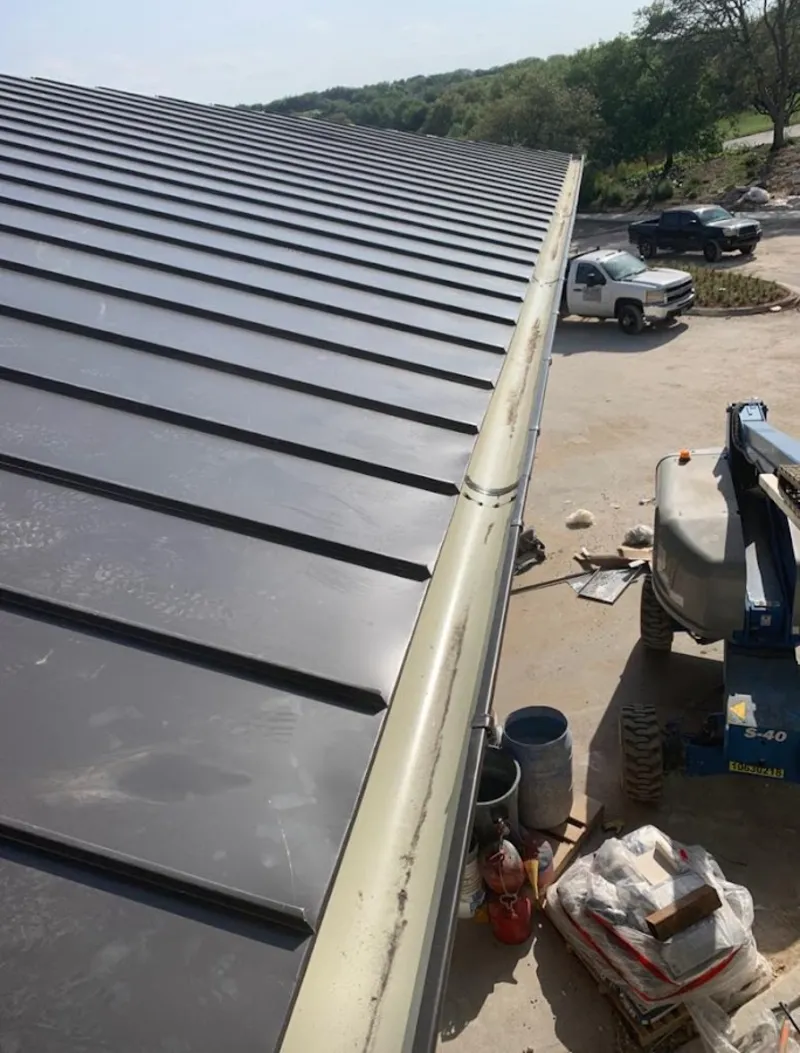 Standing seam panel and gutter detail on a metal roofing jobsite in Nellis AFB